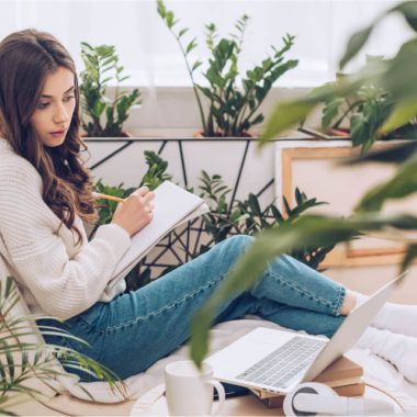 selective-focus-of-attentive-young-woman-writing-u-2021-08-30-02-15-46-utc.jpg